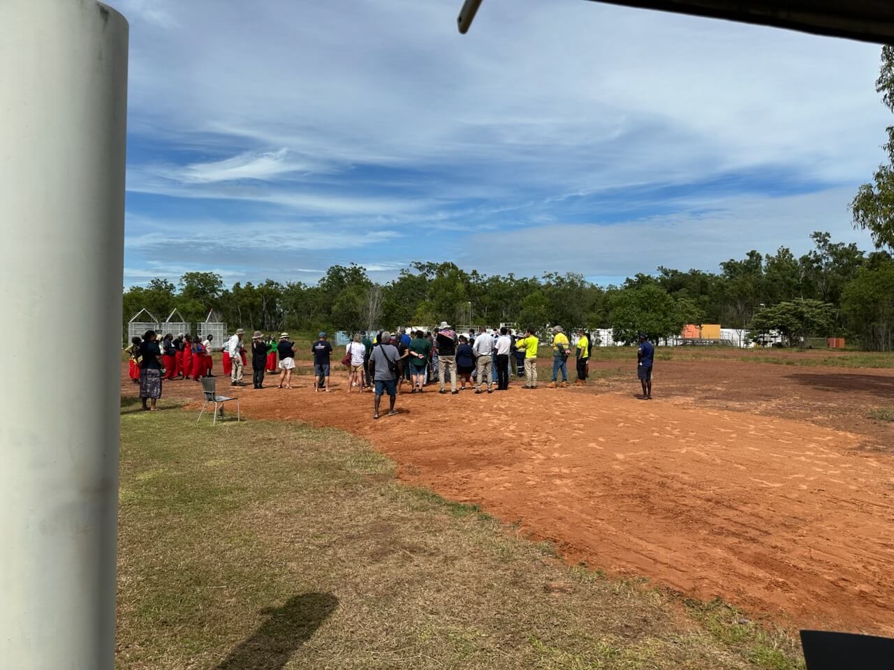 A crowd gathering in the open sun 