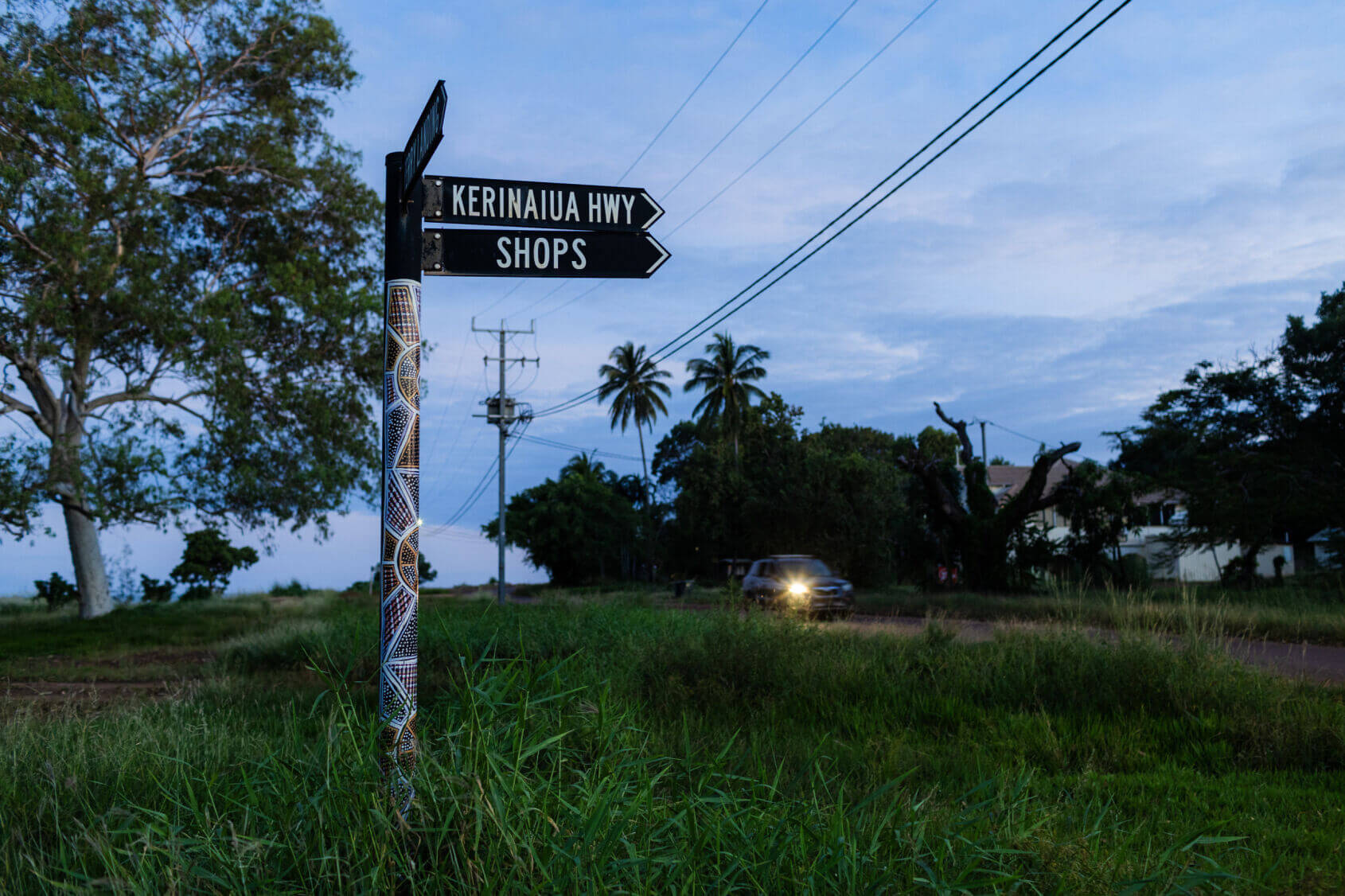 Road Sign that says Kerinaiua HWY Shops