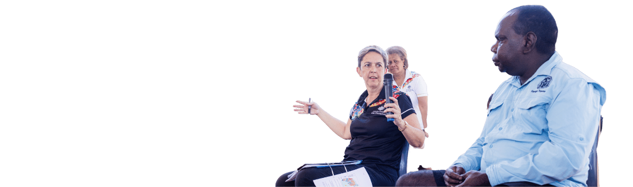 Lady sitting on Chair passing a microphone